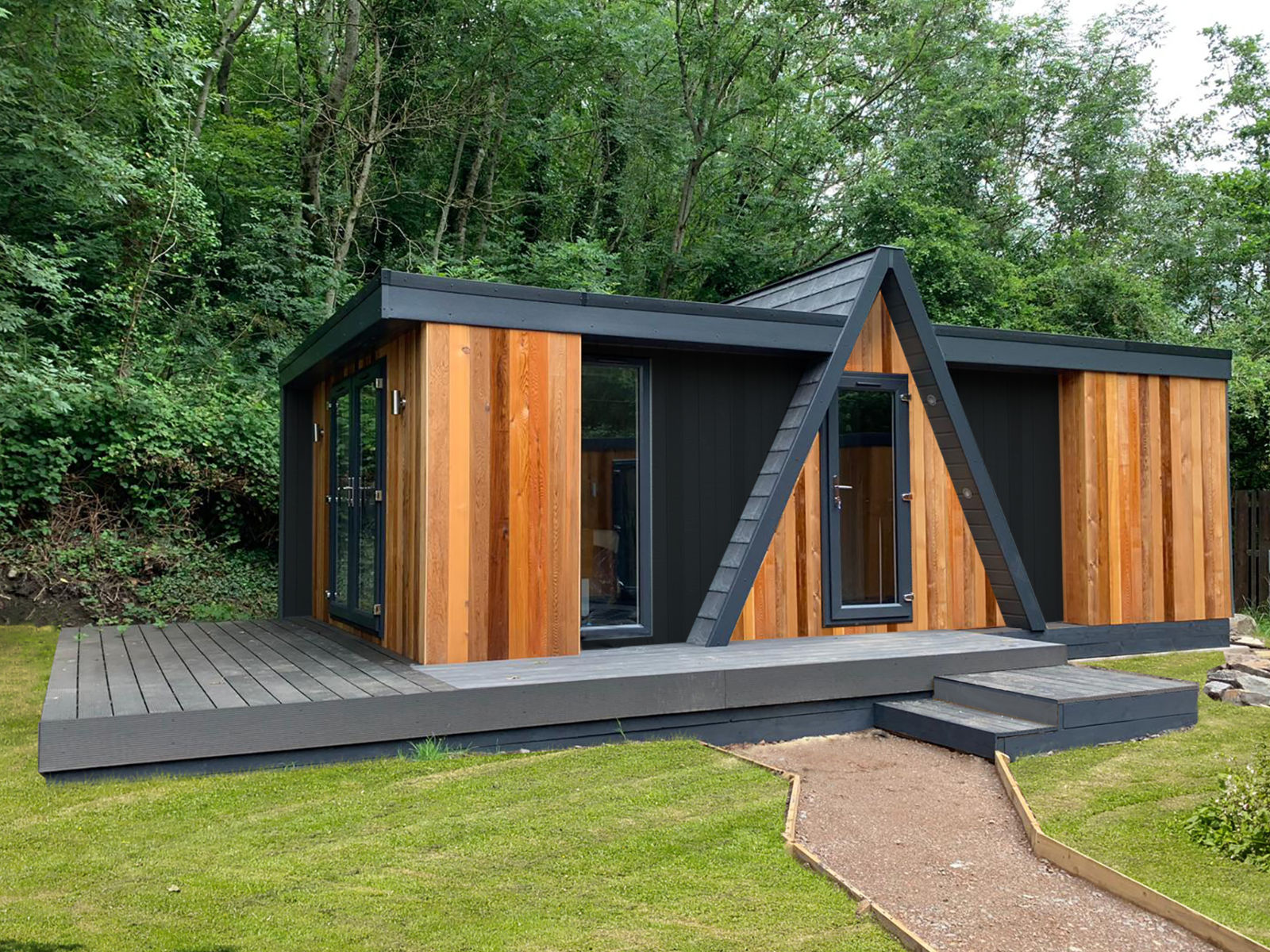 Timber-clad garden building with glazed entrance